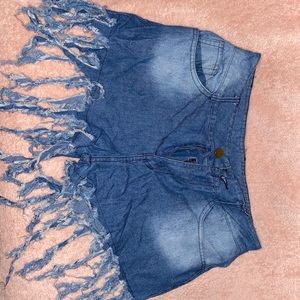 Stringy denim shorts.